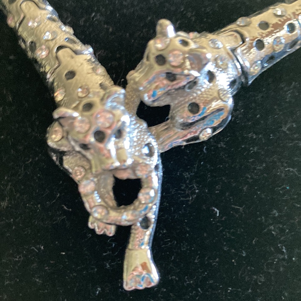 Silver two tigers together necklace.